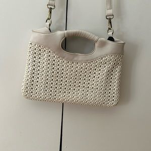 Anthropologie cream woven leather handbag with removal adjustable strap.